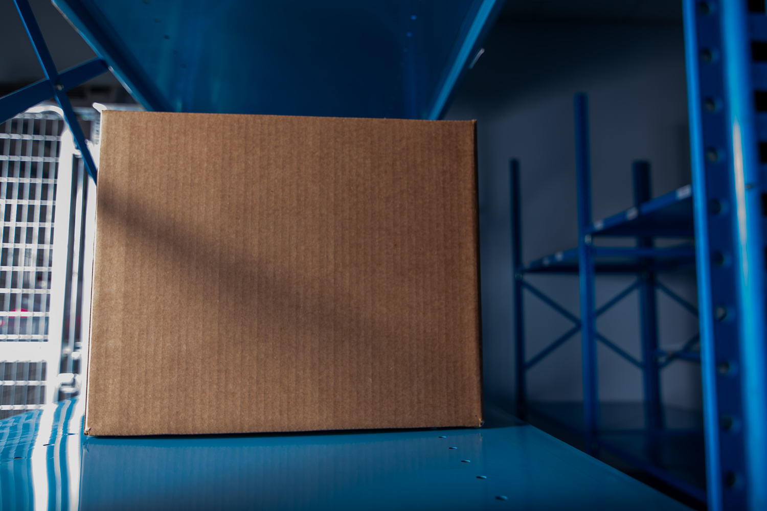 Investigational drug product stored on GMP-controlled shelving inside a secure, environmentally monitored clinical storage facility